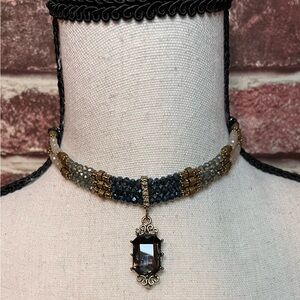 GORGEOUS: Glass seed bead triple strand choker necklace with pendant.